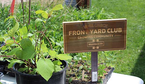 A sign in a front yard that read "Front Yard Club"