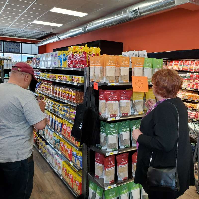 People peruse the shelves at the Corner Store