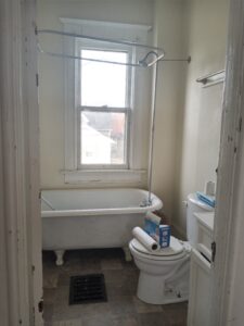 A bathroom in the rental house before renovation.
