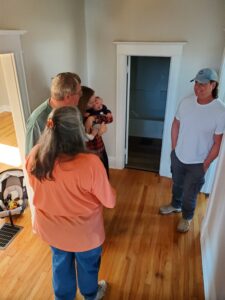 Contractor Steve Miller chats with the Reinert family.